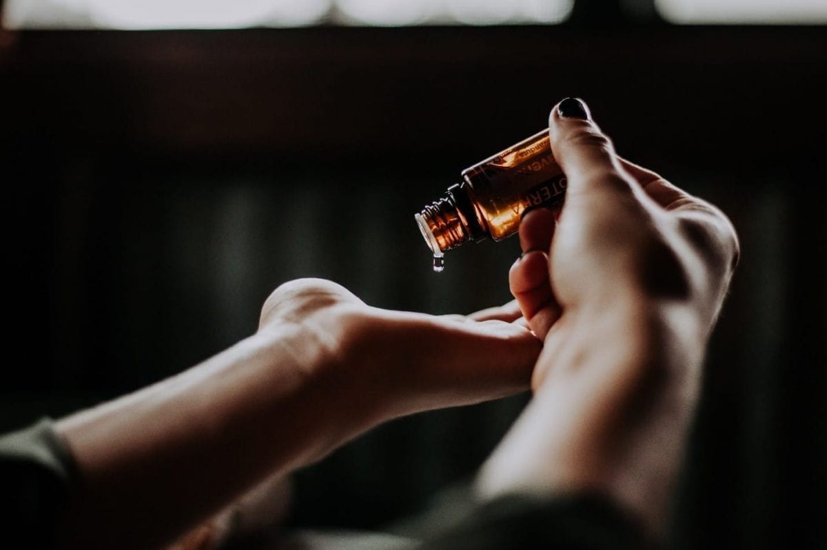 CBD Oil Drops in Hands CBD oil drop