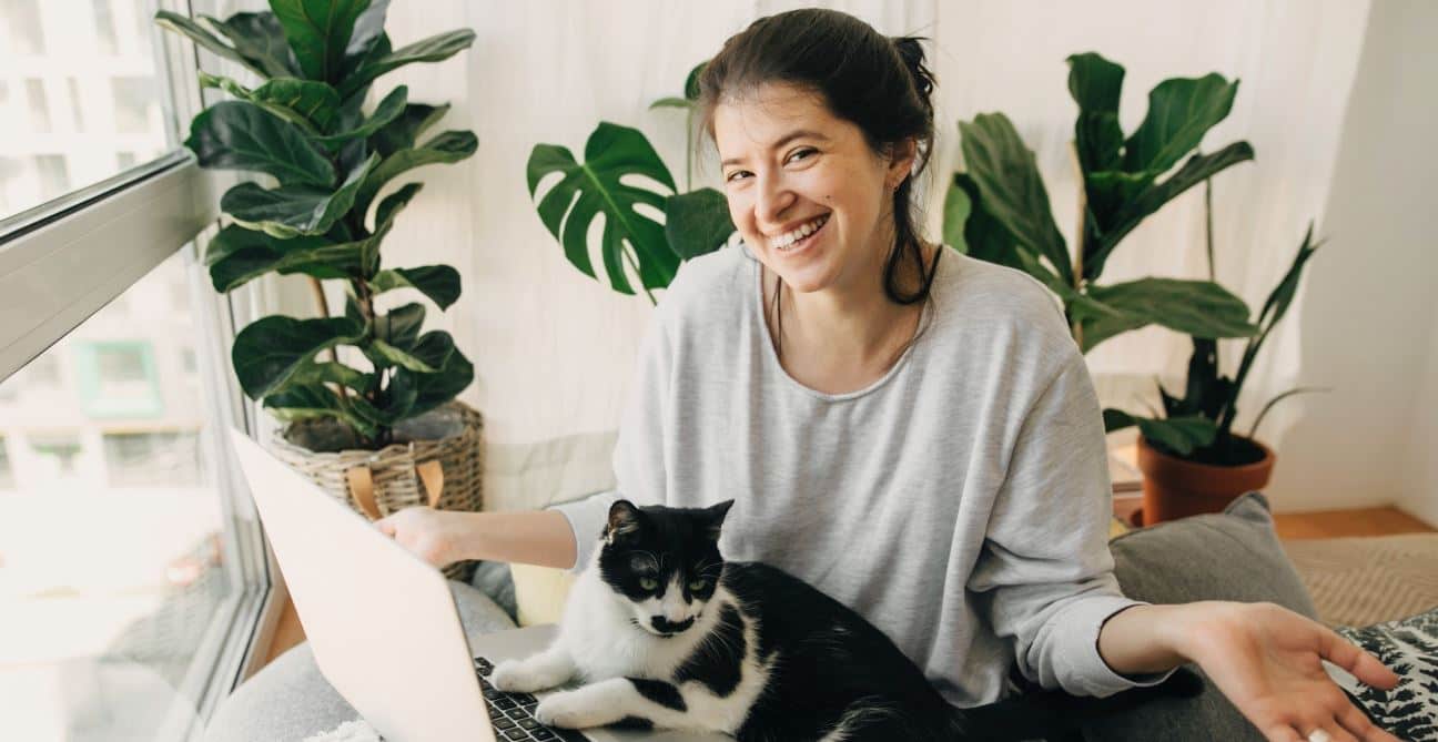 Work With Cat Woman works from home with her cat